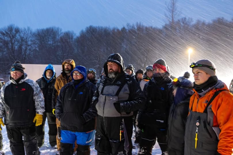 Anglers gathered outdoors in falling snow, from MN Made Outdoors’ 2027 registration announcement